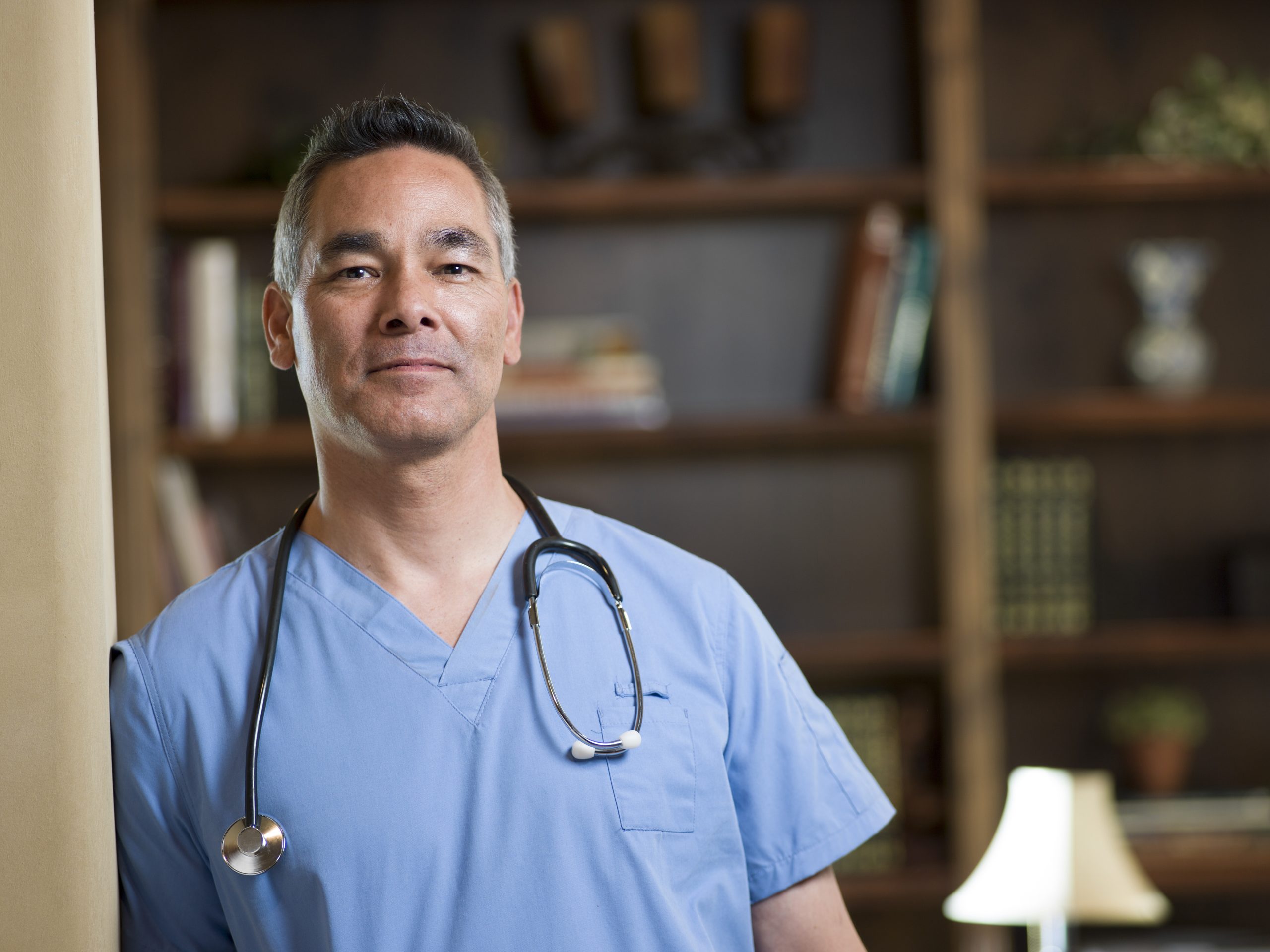 Confident healthcare professional posing in a clinic