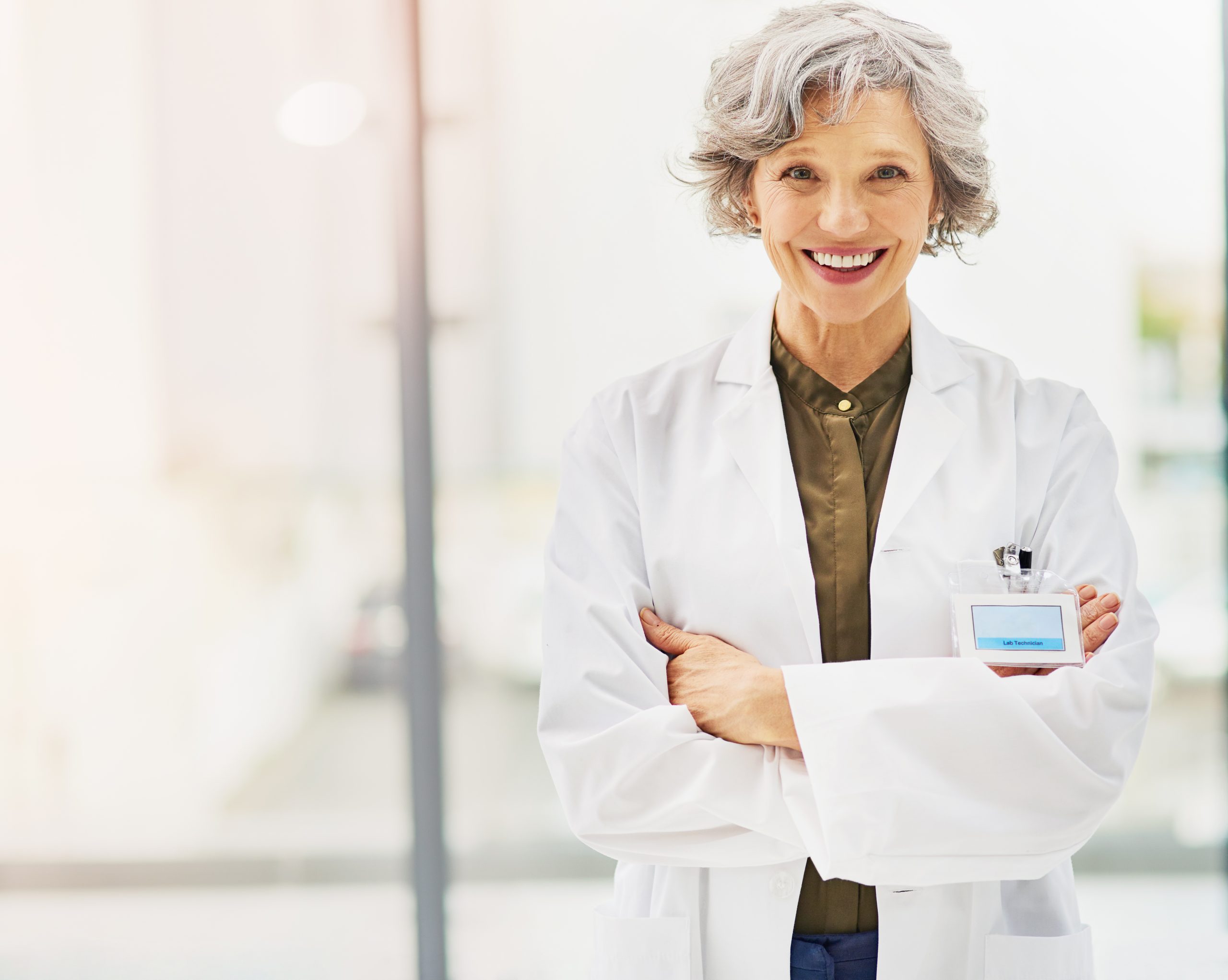 Portrait of a confident and mature doctor folding her arms.